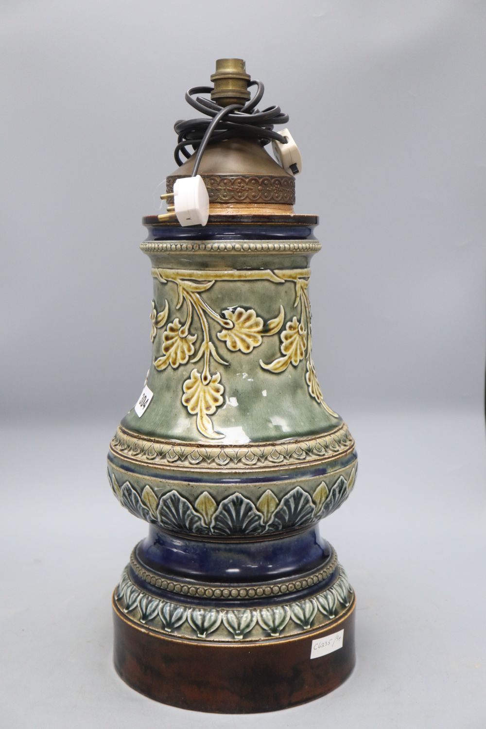 A large Doulton style stoneware lamp base, overall height 50cm